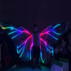 Plasma Dragon LED Wings with blue and multicolour lights, opened wide by a performer