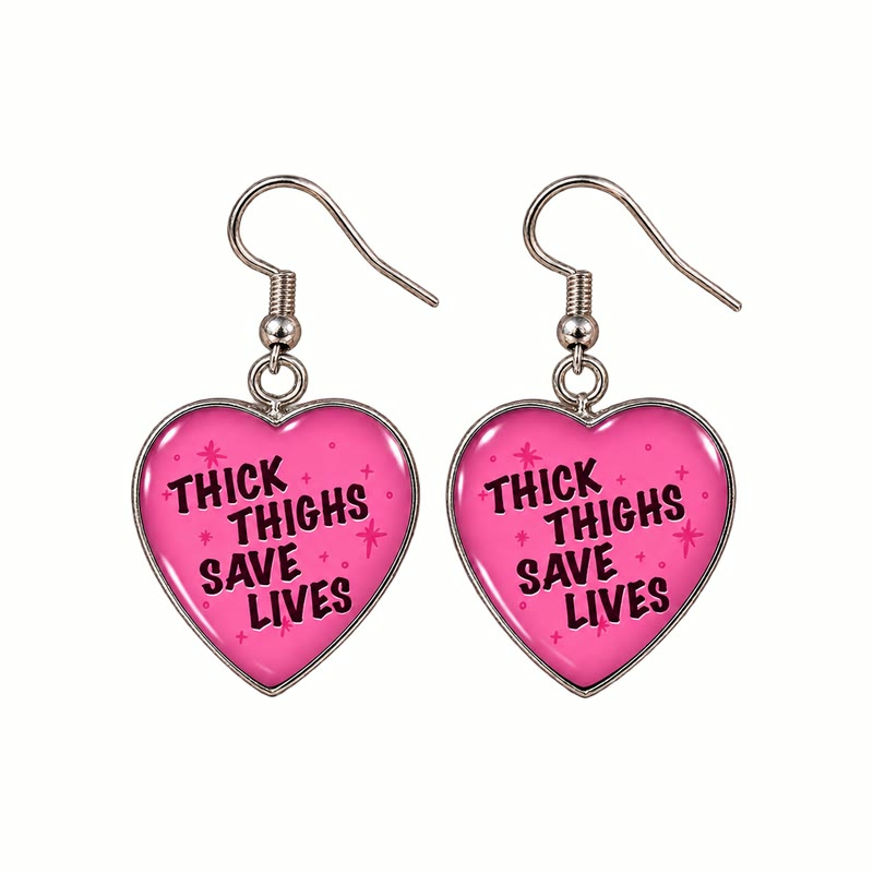 Doof Earrings in Muscle Mummy, pink hearts reading Thick Thighs Save Lives