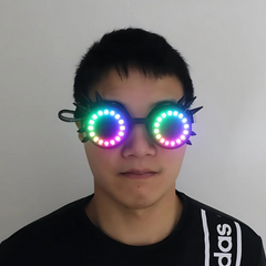 Steampunk Halo LED Goggles (Performer Grade) worn by a man with rainbow LED rings glowing