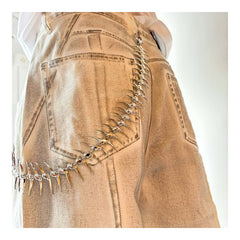 Vertebra Waist Chain worn on cream washed denim pants | styled view