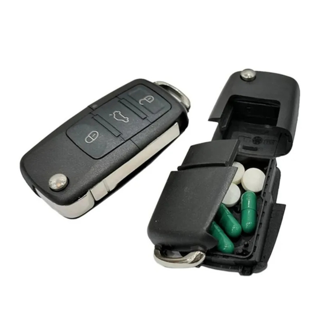 Car key fob replica opened to show a small storage compartment inside the casing