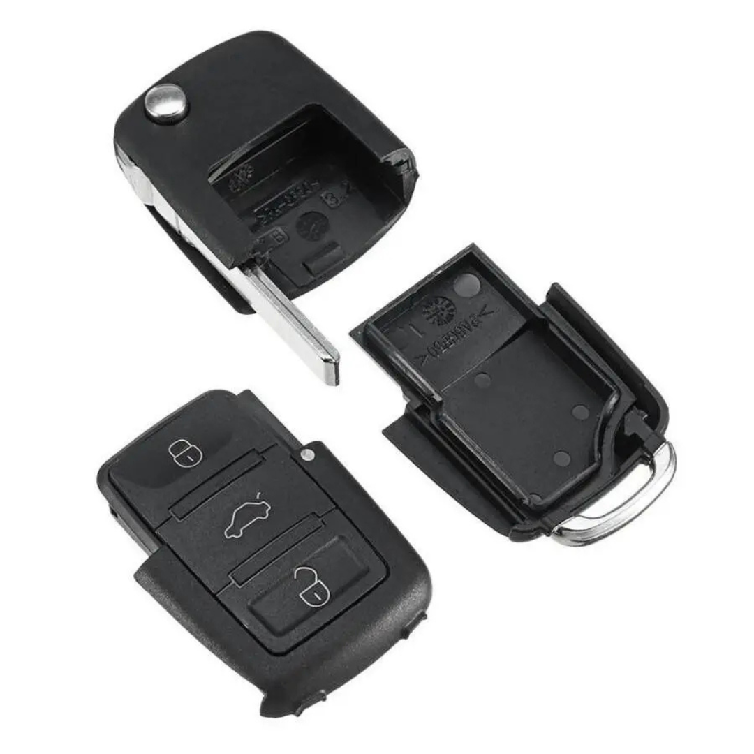 Car key fob replica taken apart, showing the flip key blade and the inner case