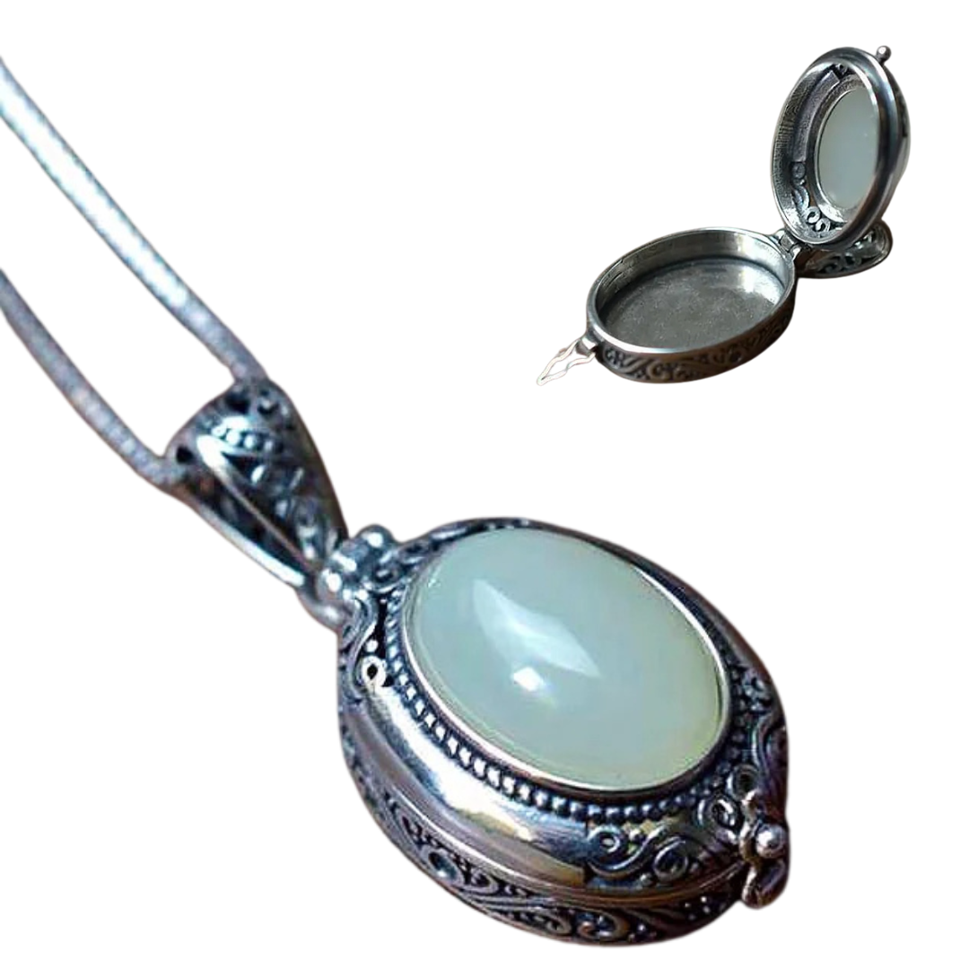 Oval locket necklace with an opal stone and ornate silver-tone frame, shown open and closed