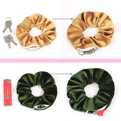 Gold and green velvet zip pocket scrunchie, showing keys and a lighter fitting in the pocket